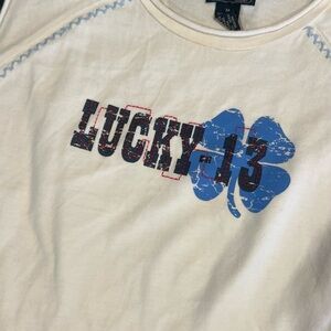 Lucky Brand White Tee with Blue Clover and Black/Red Graphic